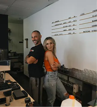 The Holy Coffee founders in their shop