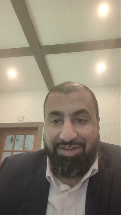 Founder of OMNI Law talking to camera in his office