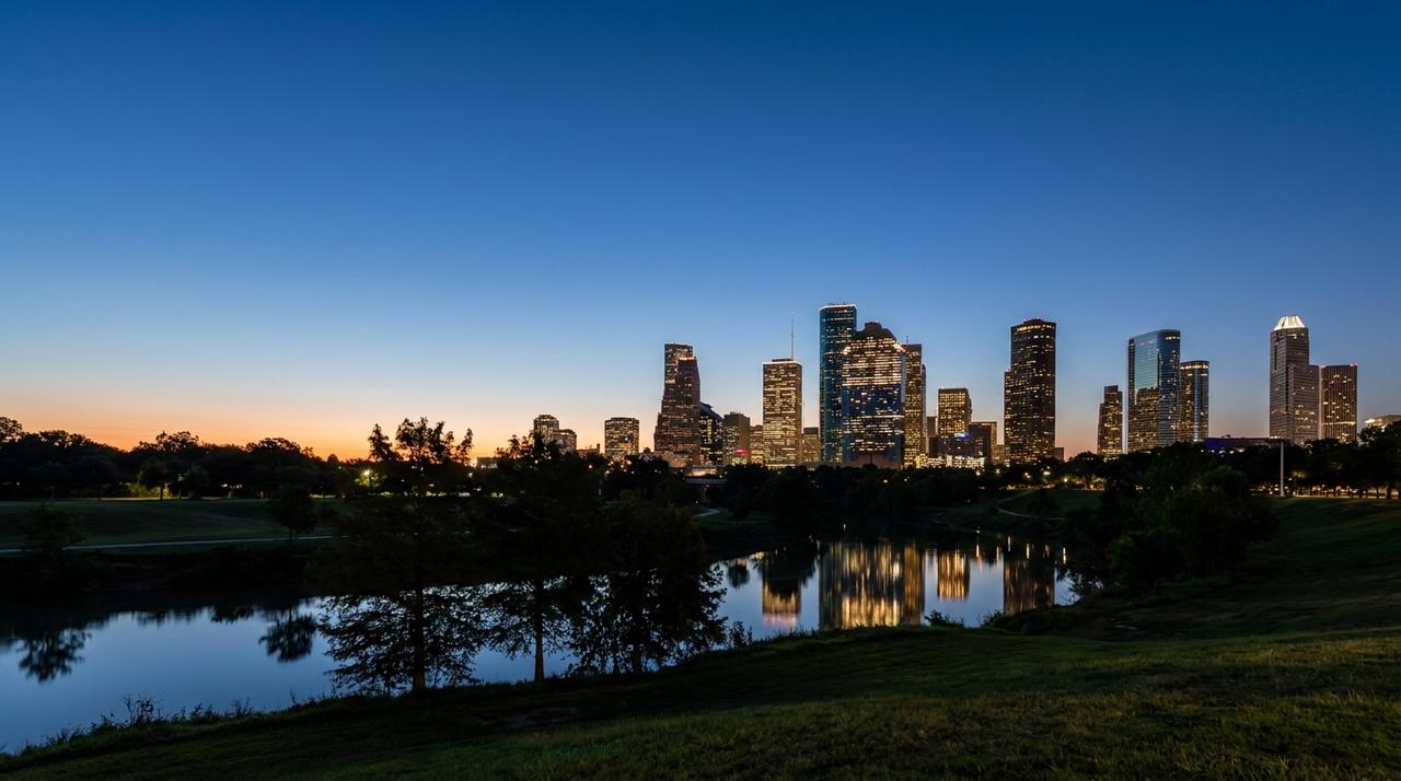 Downtown Houston skyline at blue hour above Buffalo Bayou