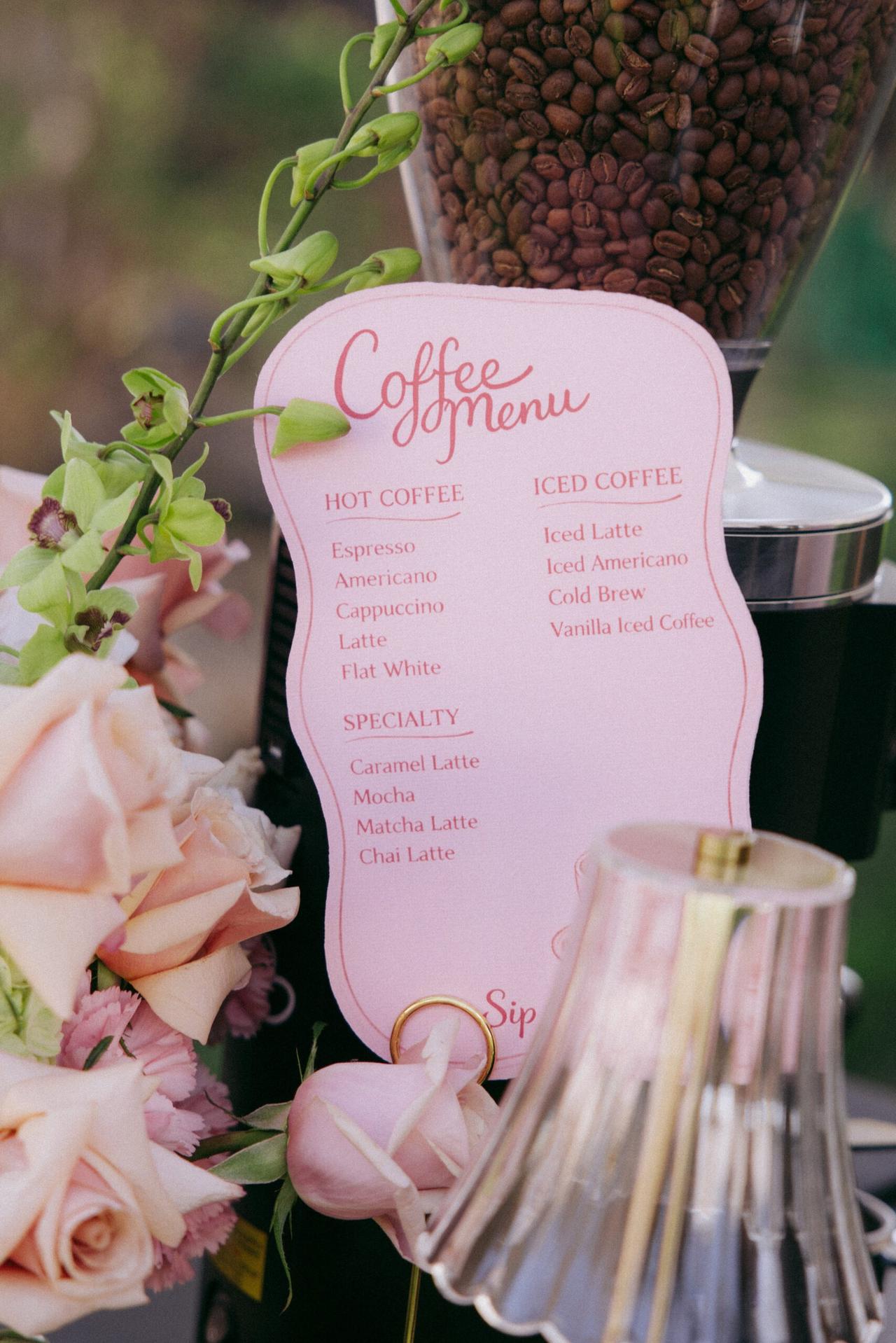 Holy Coffee menu card with roses at an event