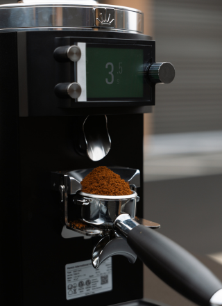 Fresh espresso grounds in the portafilter