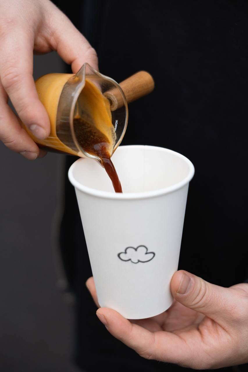 Espresso pouring into a Holy Coffee cup